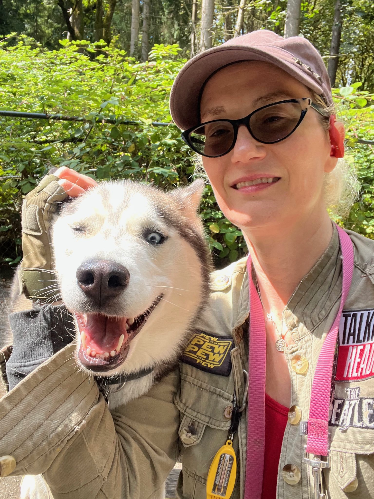 Image of dogwalker Niko Allred and a Husky dog.